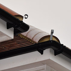 Dormer roofing with hip irons on hipped ends