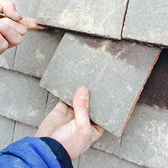 repairing and replacing a roof tile