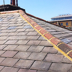 Tiled roof replacement slate tile repairs - see new slate tiles marked with X
